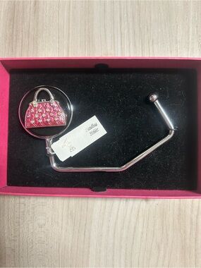 $5 in a bundle Spring Street handbag holder featuring a pink, rhinestone-embelli